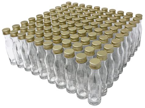 Set von kleinen, leeren Glasflaschen mit goldenen Schraubverschlüssen