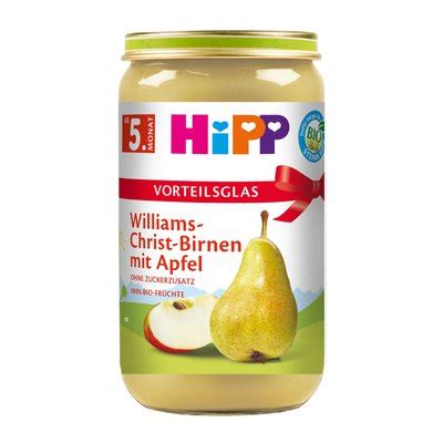 Bild eines geöffneten HiPP Bio Gläschens mit Birnen-Dessert, daneben ein Löffel mit der Fruchtmasse.