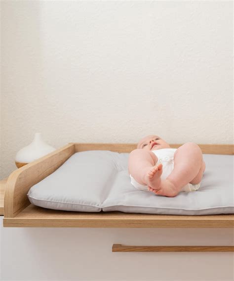 Illustration zur Druckverteilung auf einer gepolsterten Wickelauflage