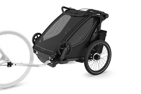 Illustration eines Thule Chariot Fahrradanhängers mit angebrachter Anhängerkupplung am Fahrrad.