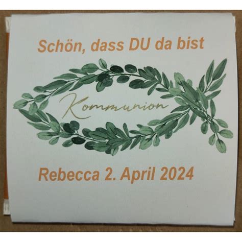 Verschiedene Gastgeschenke zur Babyparty, darunter personalisierte Teebeutel und Mini-Honiggläser