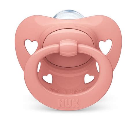 Das Design des NUK Signature Schnullers mit herzförmigem Mundschutz und niedlichem Ring