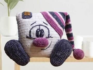 Gehäkelter Teebeutel im Amigurumi-Stil mit Gesicht und Zuziehschlaufe