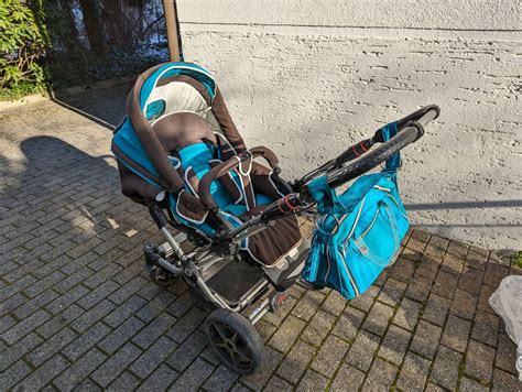 Hartan Kinderwagen mit passendem Zubehör wie Sonnenschirm und Wickeltasche